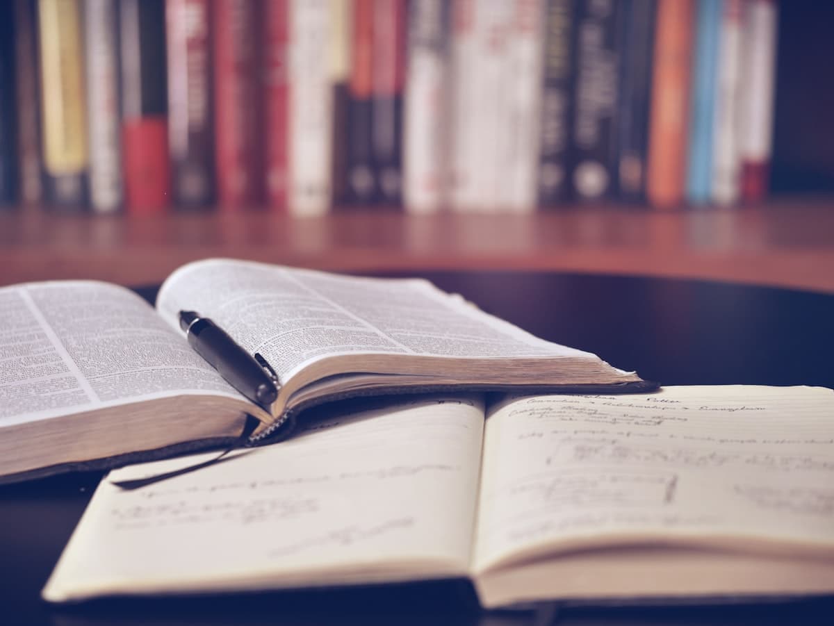 An organized desk with books and notes for thoughtful financial planning.